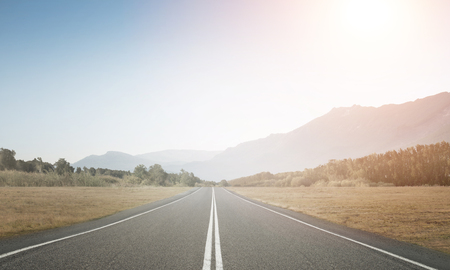 Natural summer landscape with asphalt road to horizon