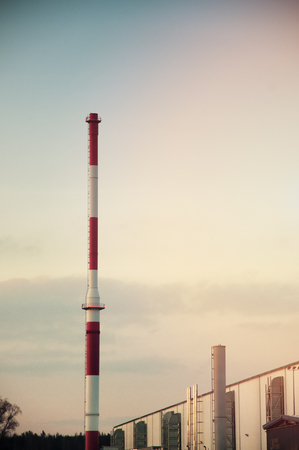 Red chimney and white buildings