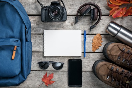 Set of trip stuff on wooden background