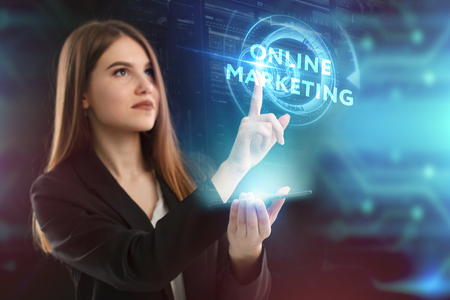 The concept of business technology the internet and the network a young entrepreneur working on a virtual screen of the future and sees the inscription online marketing Stock Photo