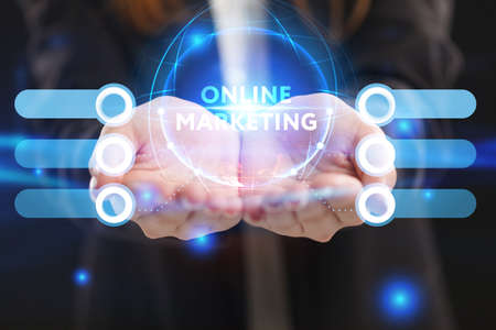 Business technology internet and network concept young businessman working on a virtual screen of the future and sees the inscription online marketing