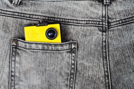 Action camera in trouser jean pocket for travel