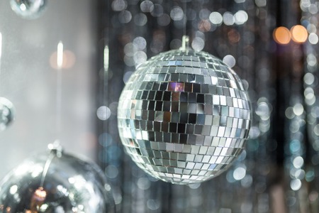 Disco ball with bright rays blue toned night party background photo Stock Photo