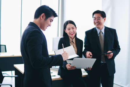 Asian group meeting business people senior tranning asian businessman group discussion happy faces of suitma working for success in office Stock Photo