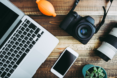 Digital camera on wooden table