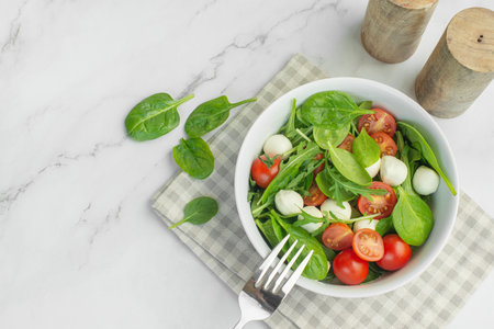 Salad of fresh vegetables and herbs with mozzarella Stock Photo