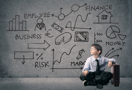 A very young businessman sitting on the ground Stock Photo