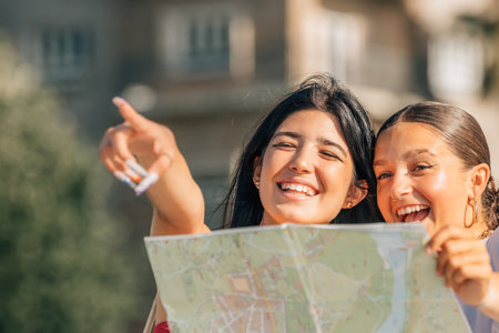 Girls with map on travel street