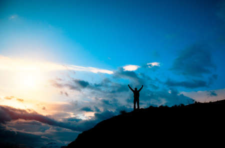 Man in mountain at sunset Stock Photo