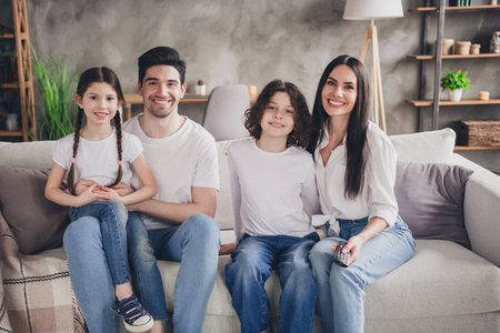 Photo of pretty cheerful boyfriend girlfriend kids wear casual looks enjoying weekend indoors room home house