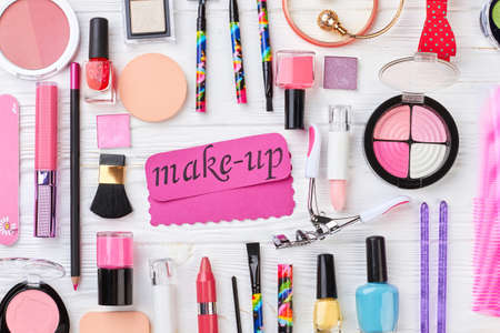 Ladies beauty cosmetics and accessories colorful cosmetics products and jewelry on white wooden background make up accessories fashion collection