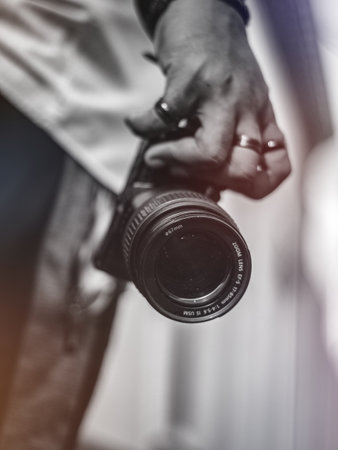 Photographer with camera in his hand filtered image processed vintage effect Stock Photo