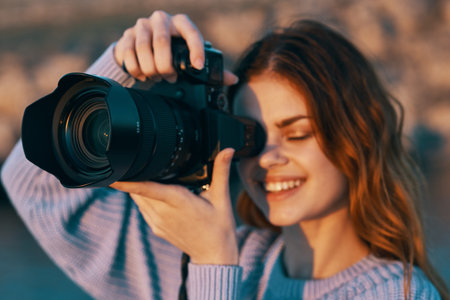 Happy woman photographer outdoors in mountains professional landscape model Stock Photo