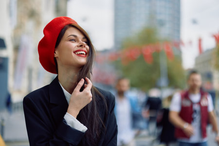 A beautiful smile woman with teeth walks in the city against the backdrop of office buildings stylish fashionable vintage clothes and makeup autumn walk travel