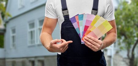 Close up of painter with color charts