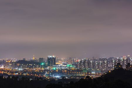 Night scenery of taipei city with beautiful reflections of skyscrapers a moody nightscape of taipei taiwan Stock Photo