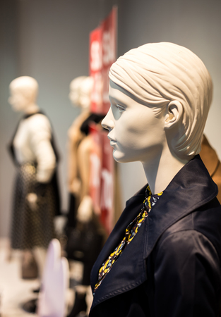 Profile of white female mannequin in the showcase Stock Photo