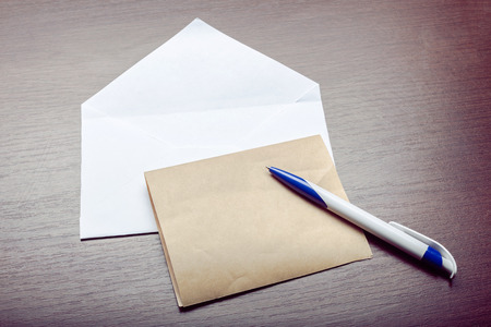 Photo of blank envelope on a wooden background
