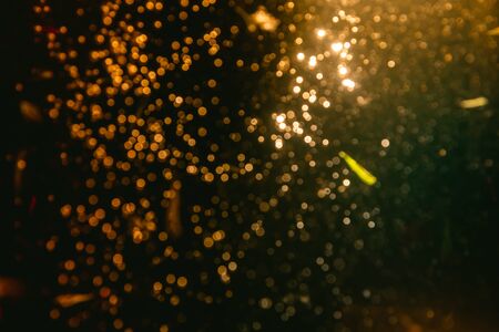 Fantasy abstract blur golden bokeh of lights colorful sparkle use for background
