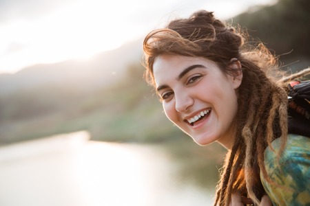 Caucasian woman looking around the lake side