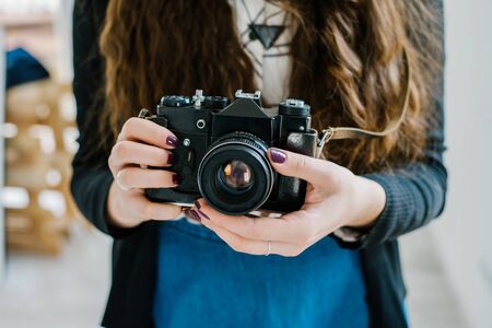 Vintage old camera in hand Stock Photo