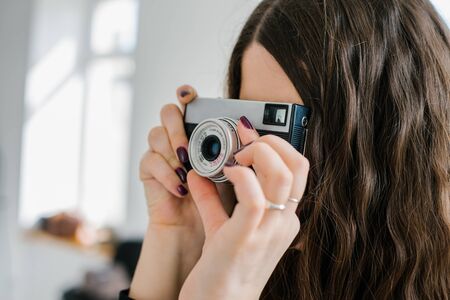 Long haired brunette girl photographed on an old camera