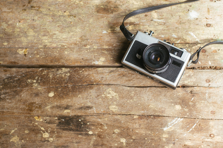 Vintage film camera on wooden table