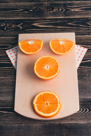 Orange half of orange orange lobule on the wooden table healthy lifestyle concept