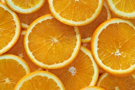 Background from orange slices rings of orange Stock Photo