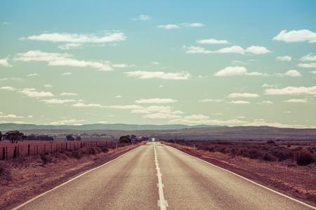 Rural highway passing through south australian countryside on bright sunny day