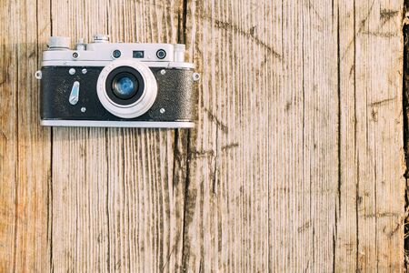 35mm vintage old retro small format rangefinder camera on old wooden