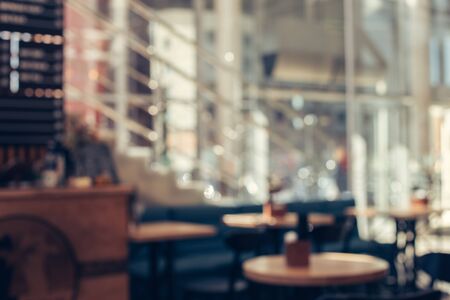 Blurred background of cafe with big windows on a sunny day Stock Photo