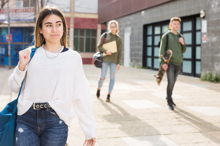 Portrait of teenager girl with schoolbag