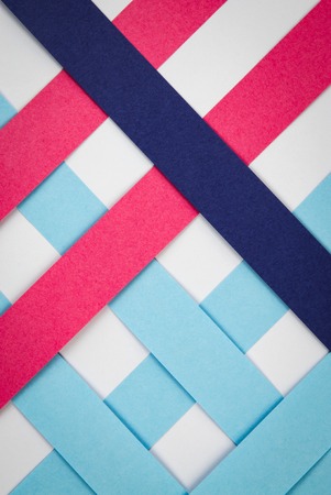 Abstract background grid with strips of colored paper