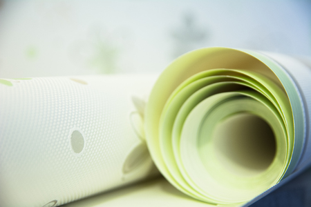 Two rolls of vinyl wallpaper for room repair Stock Photo