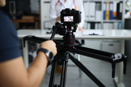 Videographer filming doctor on medical remote training Stock Photo