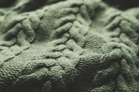 Knitted dark soft woolen fabric closeup view