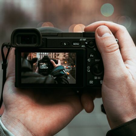 Taking pictures with camera through another camera and lens