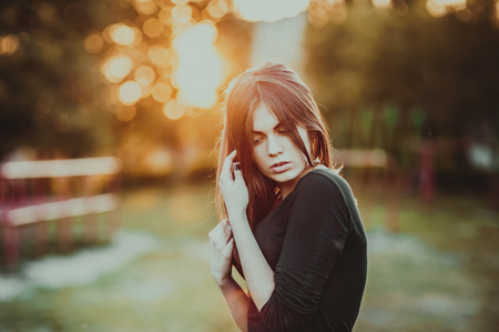 Pretty woman posing in sunset light Stock Photo