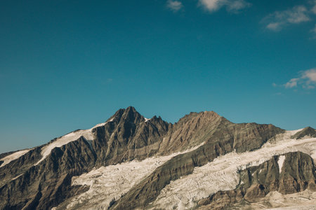 Landscape with clouds and snowed mountains