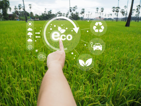 Environmental technology concept eco technology pointing connecting technology to save the earth green background eco icon is bright