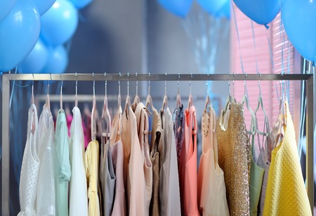 A few beautiful wedding or evening dresses on a hanger