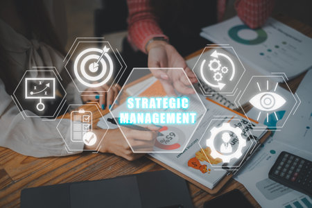 Strategic management concept business team analysis summary graph reports of business operating expenses and work data on desk with strategic management icon on virtual screen