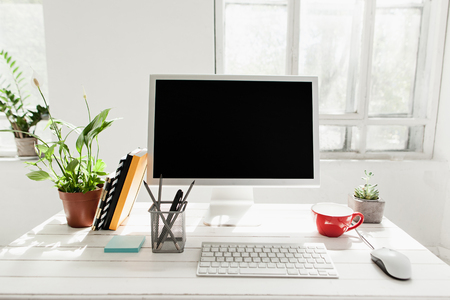 Stylish workspace with computer at home or studio