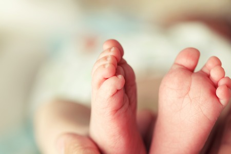 Beautiful soft newborn baby feet close up