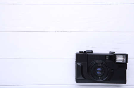 Vintage camera on white wooden background old photo camera on wooden background