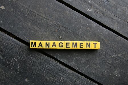 Management concept word made of cubes vintage style