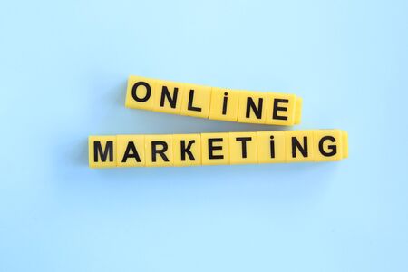 Online marketing concept inscription of yellow cubes on a blue background