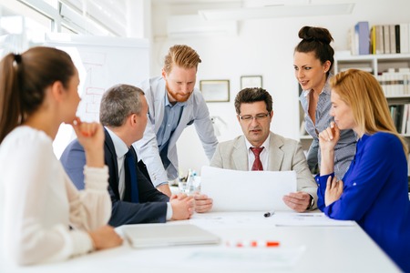 Business people and architects discussing future plans Stock Photo