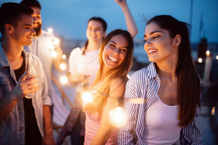 Group of young happy friends having party and fun